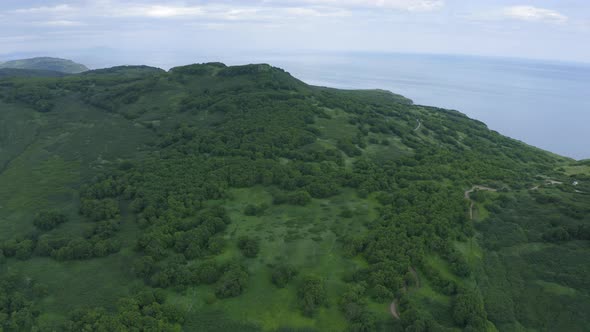 Mayachny Cape on Kamchatka Peninsula on Picturesque Avacha Bay Coast Covered By Green Grass in the