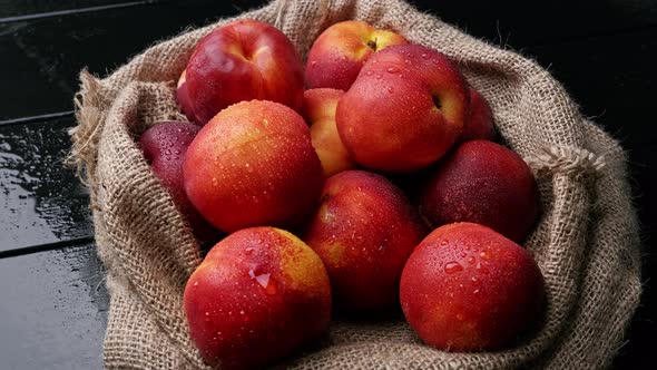 Sweet Nectarines on the Table with Burlap Cloth