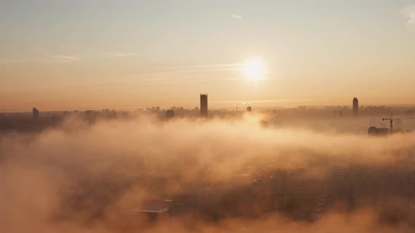 Smoke Over the City at Dawn Early in the Morning