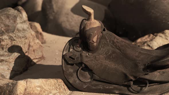 Very Old Horse Saddle on Sand Beach