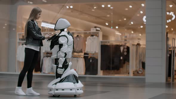 A Female Programmer Tests the Robot for the Ability to Interact with Users