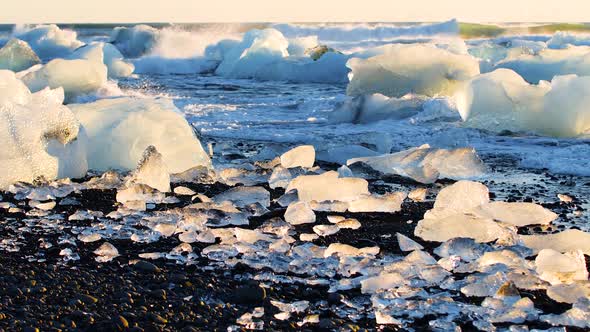 Chunks of Ice on Black Sand Beach Global Warming and Climate Change Concept Icebergs in Jokulsarlon