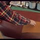 Bearded Millennial Craftsman with Mug of Hot Drink Working and Inspecting Piece of Leather While - VideoHive Item for Sale