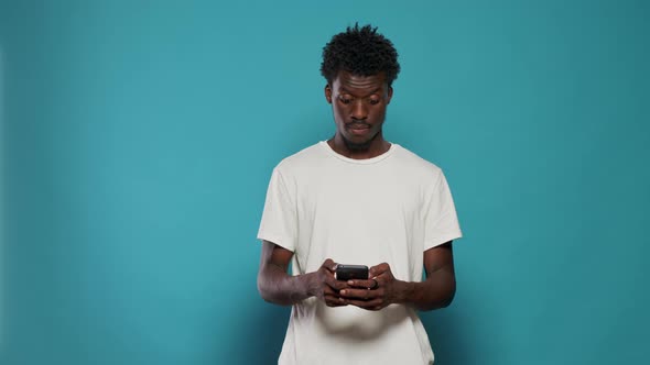 Man Using Smartphone Display and Showing White Screen to Camera