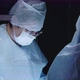 Female surgeon using scissors on operation - VideoHive Item for Sale