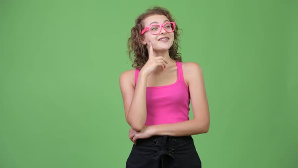 Young Happy Beautiful Nerd Woman Thinking While Looking Up