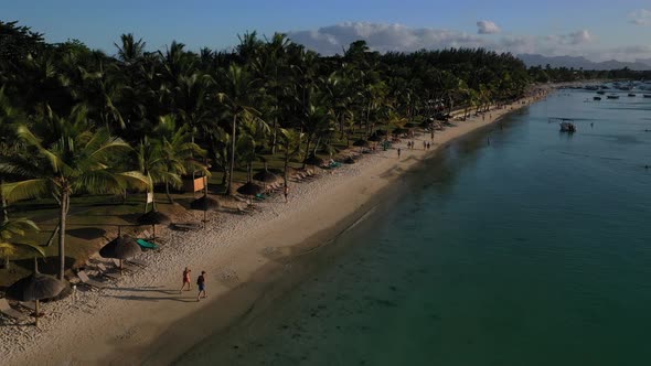 Beach Along the Waterfront and Coral Reef and Palm Trees Mauritius Africa Pier Near the Beach of the