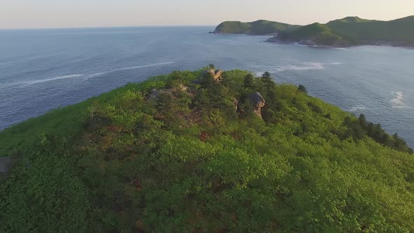 Aerial View of a Beautiful Promontory with Clear Blue Water