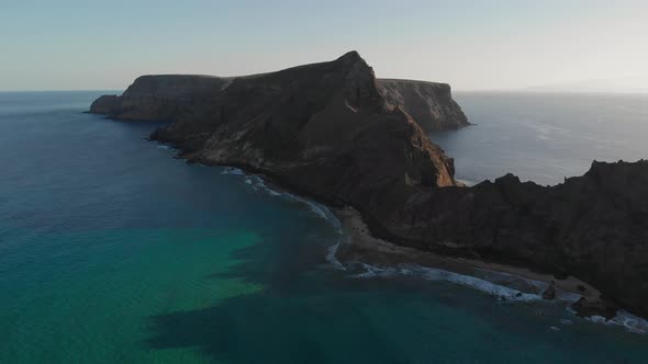 Breathtaking scenic summer flight above turquoise ocean sea waves rolling on Calheta sandy beach tow