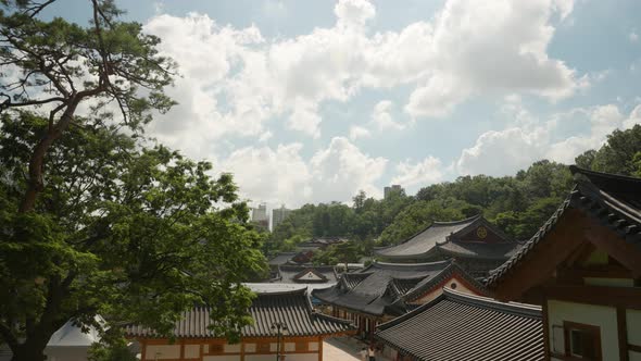 High angle view of Bongeunsa Buddhist Temple against white clouds in Seoul, South Korea