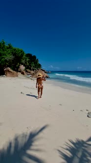 Anse Source d'Argent La Digue Seychelles Young Woman on a Tropical Beach During a Luxury Vacation in