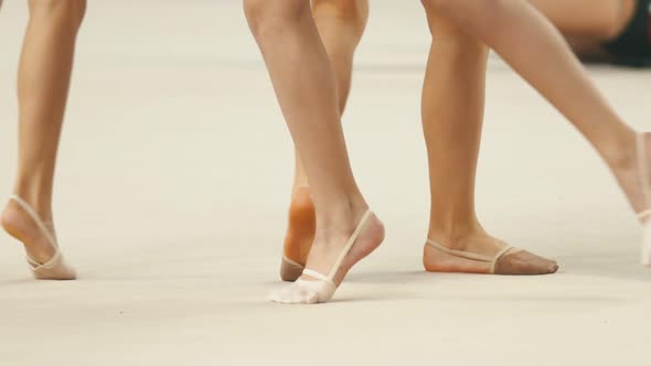 Young Women Legs at the Rhythmic Gymnastics Tournaments Warming Up on the Stage - Wearing Pointe