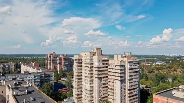 Drone Flight Over Roofs of Multi Floor Buildings District in City Outskirts