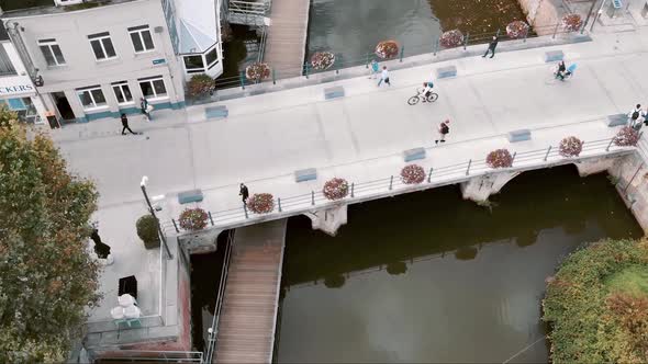 Pedestrians crossing famous Hoogbrug, Mechelen Oldest stone bridge, Belgium - Aerial