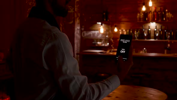 Waiter Using His Voice To Activat the Lights in the Restaurant He Works