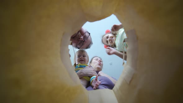 Family Woman Man And Children Look Paper Bag Shopping Joyful Faces Close