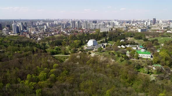 Botanical Garden on the Background of the Cityscape