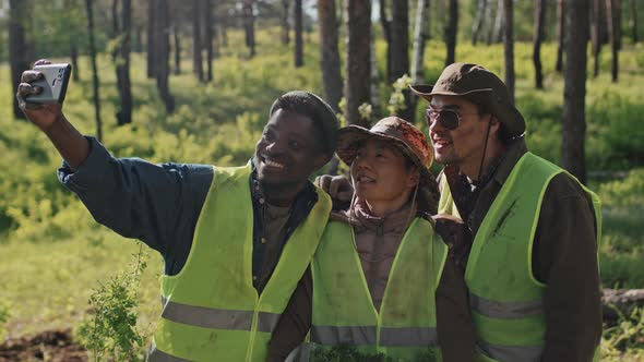 Volunteers Taking Selfie in Woods