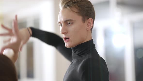 Closeup of Engrossed Caucasian Man Teaching Children and Teens Dancing in Dance Studio