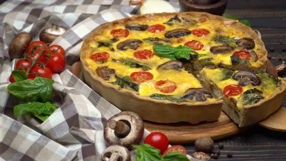 Traditional French Baked Homemade Quiche Pie on Wooden Board