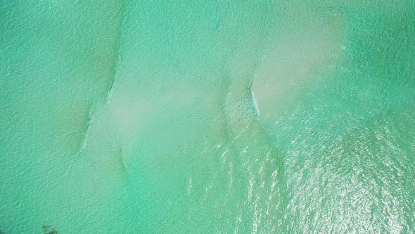 Aerial drone shot abstract of exotic shore beach adventure by blue lagoon and clean sandy background