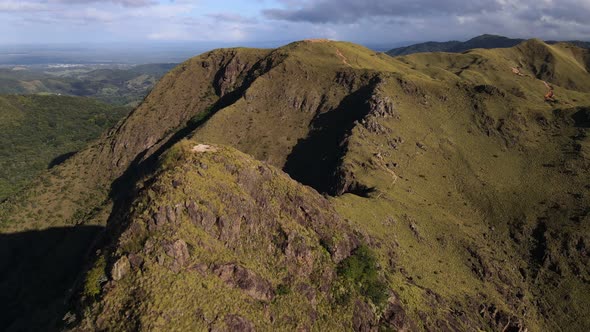 Long video of slow backwards drone flight revealing Pelado peak in northern Costa Rica during sunris