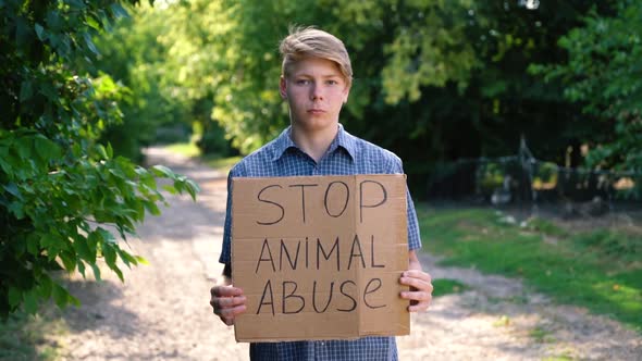 a Young Teenager of Caucasian Ethnicity a Man in a Blue Shirt Drzhin on Outstretched Arms in Front