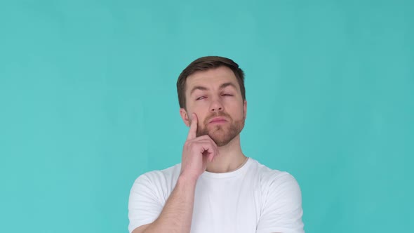 Pensive Man on a Blue Background