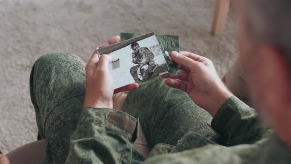 Army Soldier Showing Deployment Photos to Family