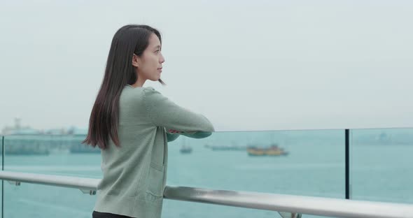 Woman looking at city of Hong Kong