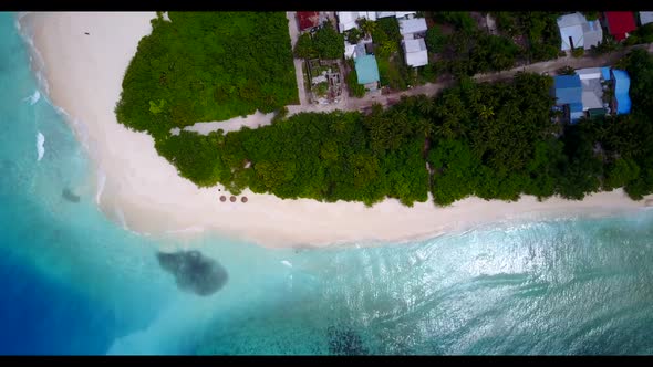Aerial top down sky of marine coastline beach journey by blue sea with bright sand background of adv
