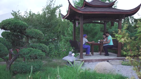 Guy and a Girl Are Sitting in the Park