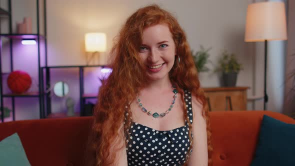 Closeup of Happy Beautiful Teenager Redhead Freckles Woman Smiling Looking at Camera at Home
