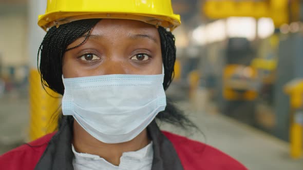 Portrait of Female Factory Engineer in Mask