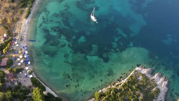 View From Above Aerial View of a Boat Sailing on a Transparent and Turquoise Sea