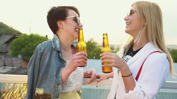 Young Women Drinking Beer Outdoors, Having Fun Outdoors