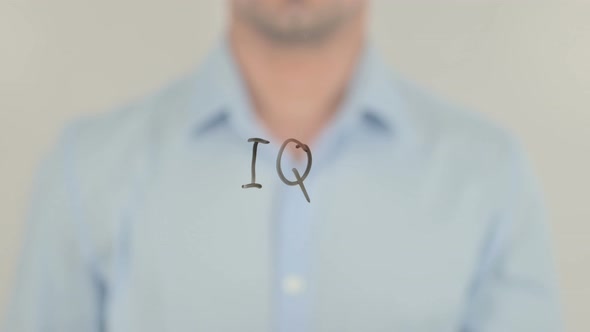 IQ, Man Writing on Transparent Glass Screen