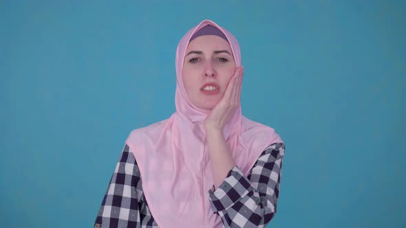 Portrait of Young Beautiful Muslim Woman Experiencing Severe Toothache