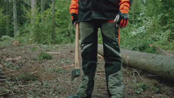 Female Logger Stands in the Forest Young Specialist Woman in Protective Gear Holds an Axe in Her