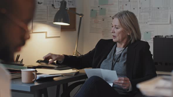 Female Prosecutor Posing at Desk