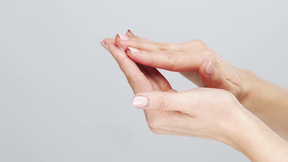 Beautiful female hands studio close-up. Arms of young woman.