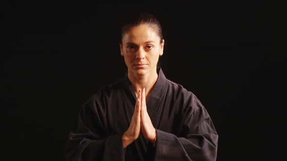 Karate player in prayer pose