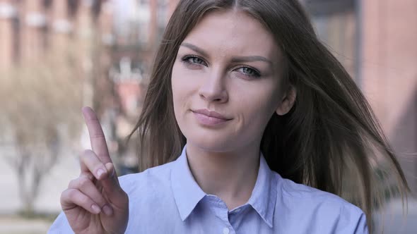 No, Young Woman Rejecting Offer by Waving Finger