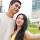 Young asiatic couple in love outdoors taking selfie smilling happy enjoying time together - VideoHive Item for Sale