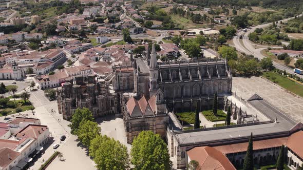 Batalha Monastery in Leiria, Portugal,  on sunny day - circling, drone shot