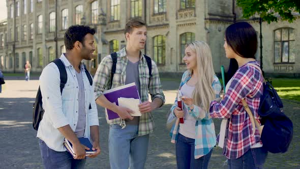 Group of Female and Male Classmates Discussing Exams, University Friends