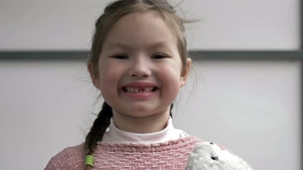 Portrait of a 67 Year Old Girl Rejoicing at a Lost Tooth