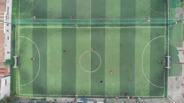 Start of Training Before a Football Match. Game Process. Aerial Shot of a Small Soccer Field, Two