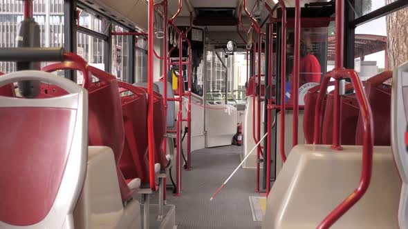 independence, autonomy - man with a disability gets on the bus with his cane