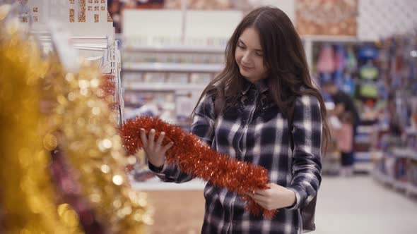 Pretty Woman Buying Christmas Decorations